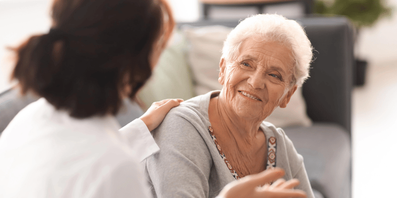 nurse comforting hospice care patient